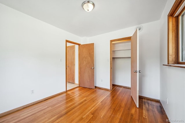 429 Overlook Dr, Bailey, CO 80421 - unfurnished bedroom featuring wood finished floors and a closet