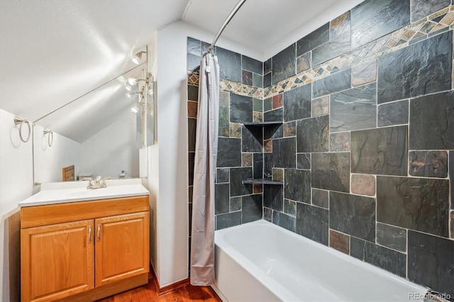429 Overlook Dr, Bailey, CO 80421 - bathroom with vaulted ceiling, shower / bath combo with shower curtain, vanity, and wood finished floors