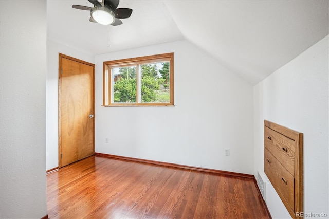 429 Overlook Dr, Bailey, CO 80421 - unfurnished bedroom featuring wood finished floors, vaulted ceiling, and ceiling fan