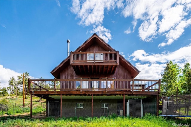 429 Overlook Dr, Bailey, CO 80421 - rear view of house featuring a deck and a trampoline