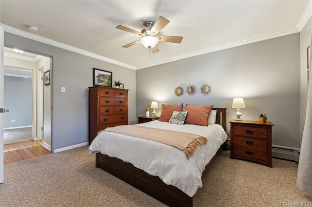 carpeted bedroom with baseboards, a baseboard heating unit, ceiling fan, and ornamental molding