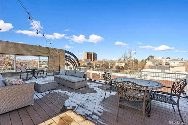 wooden deck featuring outdoor lounge area and outdoor dining area