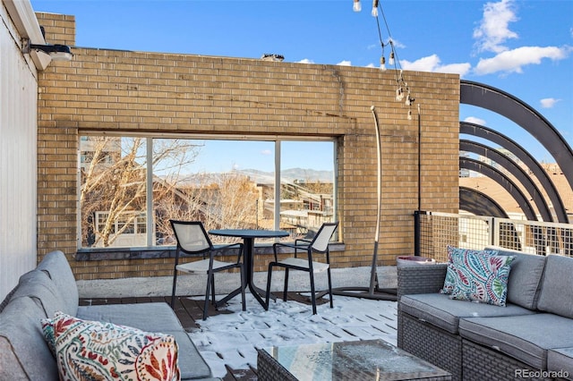 view of patio with a mountain view, outdoor lounge area, and outdoor dining space