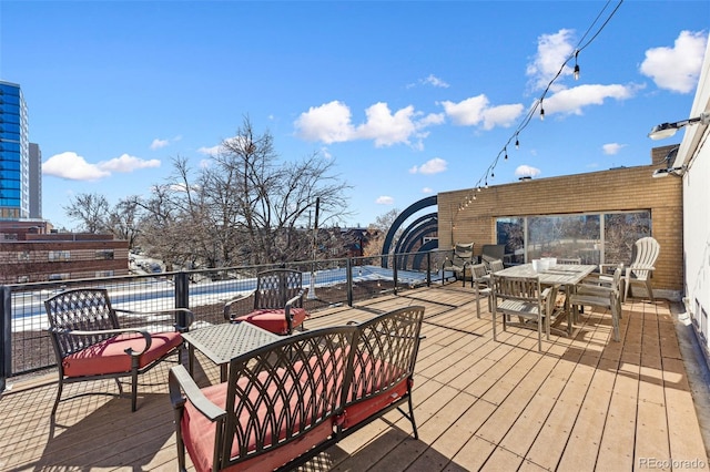 wooden deck with outdoor dining area