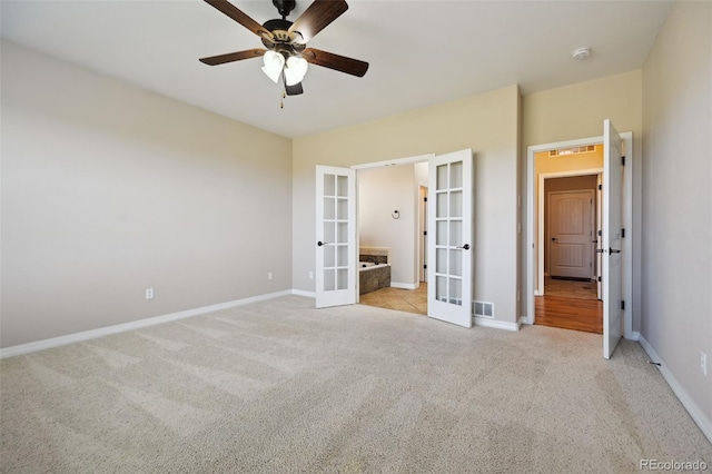 10402 Capital Peak Way, Peyton, CO 80831 - unfurnished bedroom with french doors, light carpet, and baseboards
