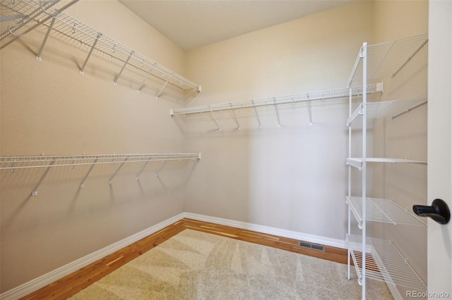 10402 Capital Peak Way, Peyton, CO 80831 - spacious closet featuring wood finished floors