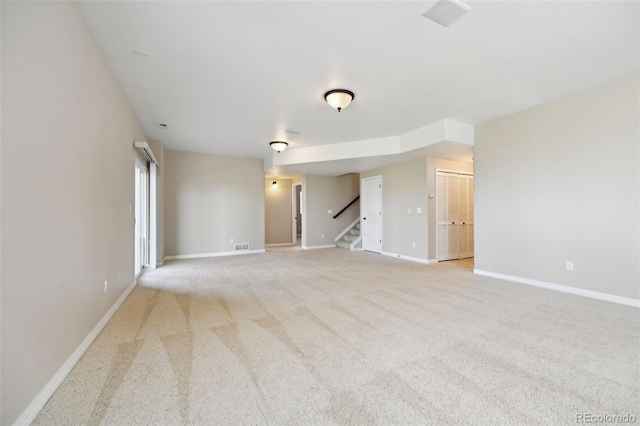 10402 Capital Peak Way, Peyton, CO 80831 - spare room with stairs, baseboards, and carpet flooring