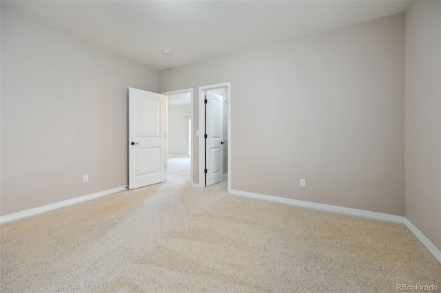 10402 Capital Peak Way, Peyton, CO 80831 - empty room with baseboards and light colored carpet