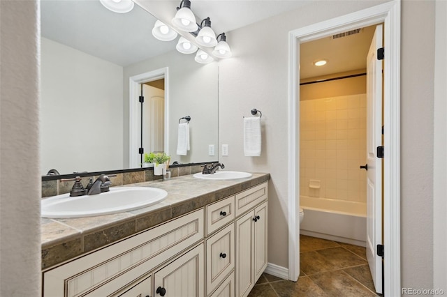 10402 Capital Peak Way, Peyton, CO 80831 - bathroom with double vanity, toilet, tile patterned floors, and tub / shower combination