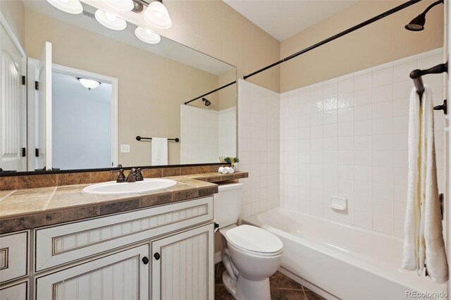10402 Capital Peak Way, Peyton, CO 80831 - bathroom featuring vanity, toilet, bathing tub / shower combination, and tile patterned floors