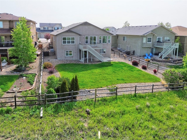 10402 Capital Peak Way, Peyton, CO 80831 - rear view of house featuring stairway and stucco siding