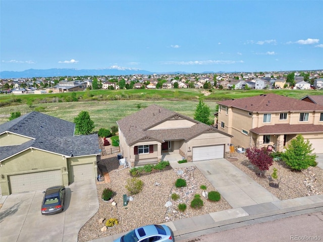 10402 Capital Peak Way, Peyton, CO 80831 - view of front of house with driveway, a residential view, a garage, and stucco siding