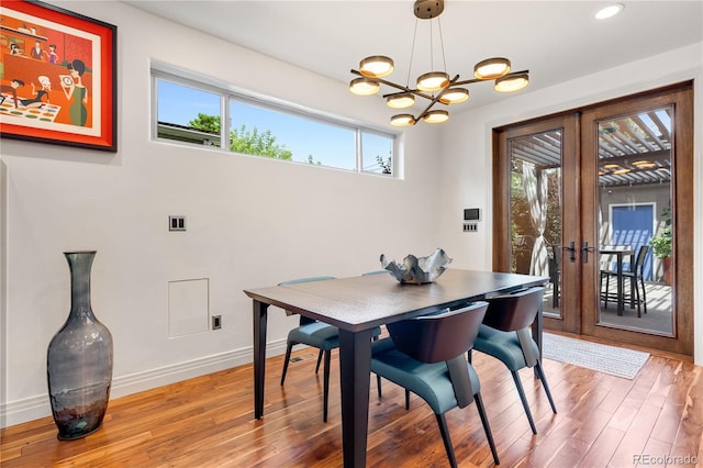 2334 Lowell Blvd, Denver, CO 80211 - dining space featuring light wood-type flooring, a chandelier, french doors, and recessed lighting