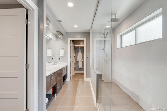 2334 Lowell Blvd, Denver, CO 80211 - bathroom featuring a walk in closet, a walk in shower, double vanity, tile patterned floors, and recessed lighting