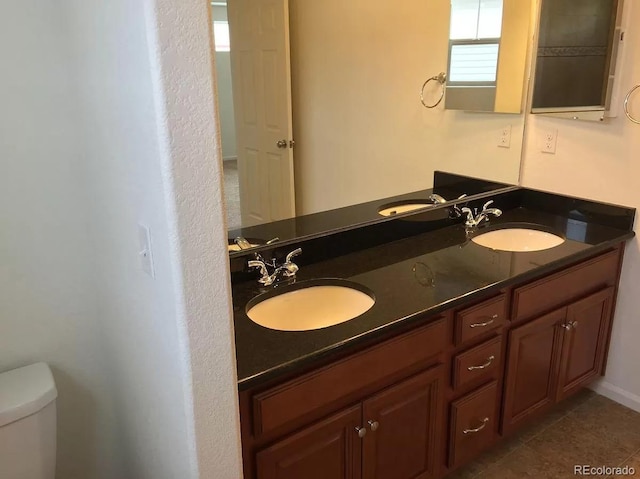 4995 S Algonquian Way, Aurora, CO 80016 - full bath with toilet, tile patterned floors, and double vanity