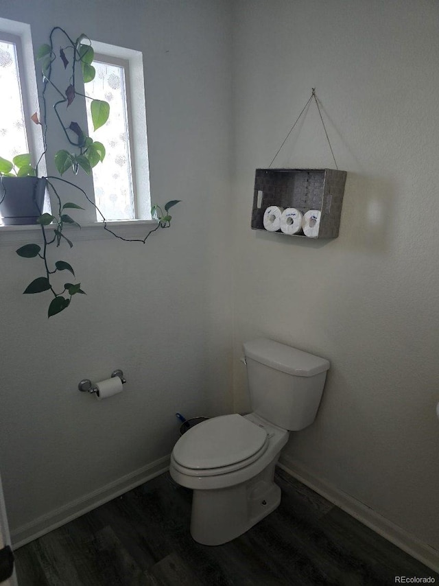 4995 S Algonquian Way, Aurora, CO 80016 - bathroom with toilet, wood finished floors, and baseboards