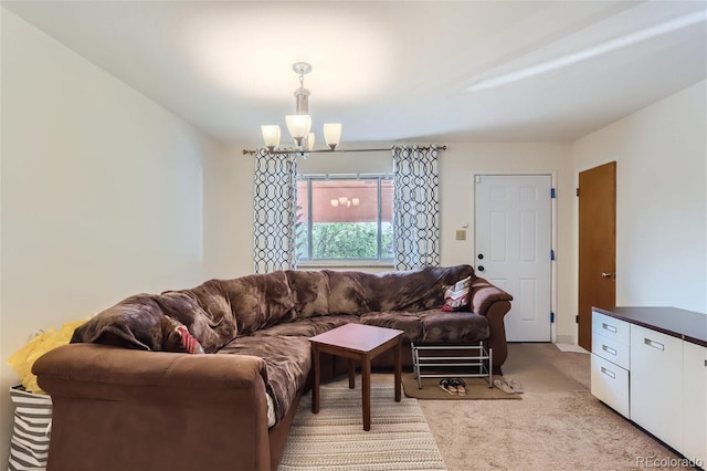 living room with a chandelier and light colored carpet