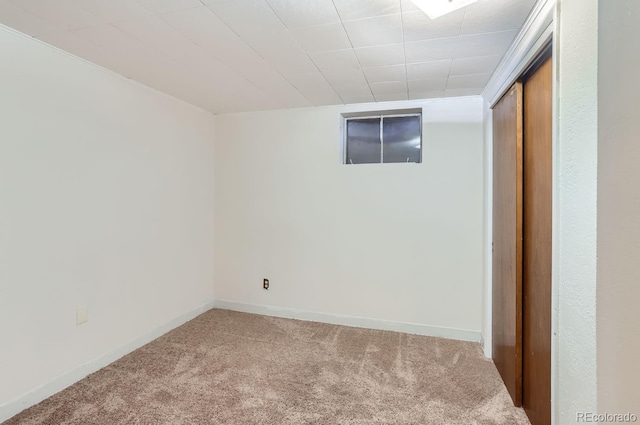 basement with carpet flooring and baseboards