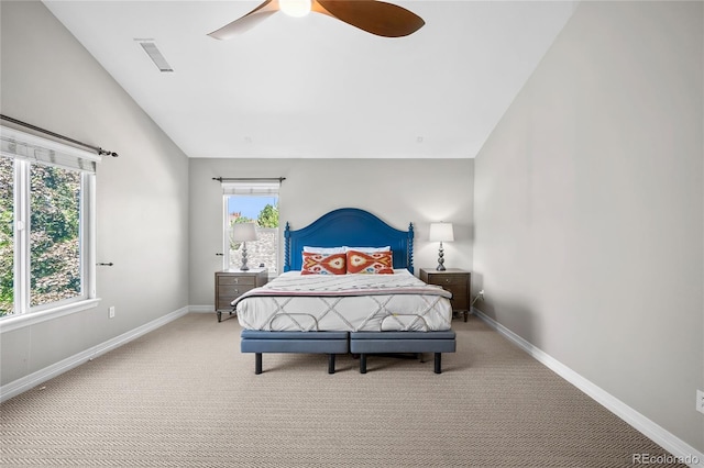 bedroom featuring carpet, lofted ceiling, and ceiling fan