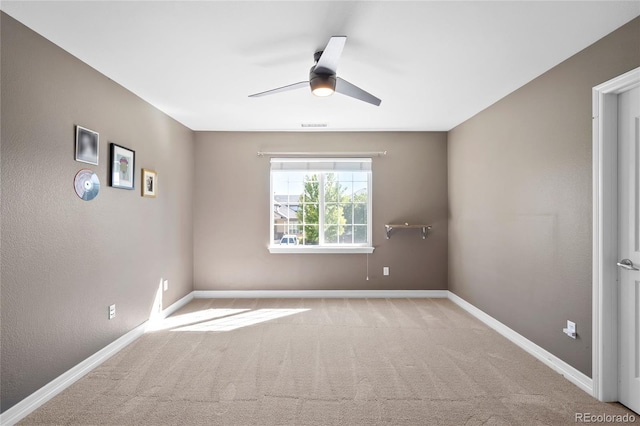 carpeted empty room with ceiling fan