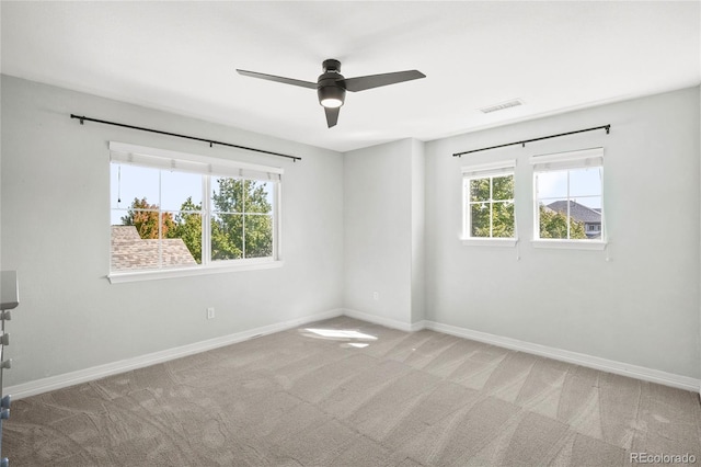 carpeted empty room with ceiling fan