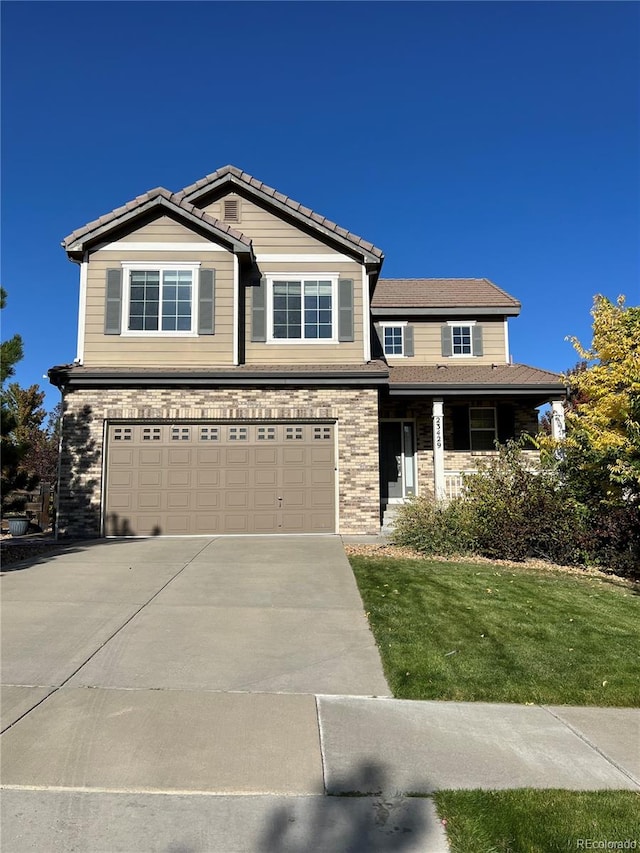 view of front facade featuring a garage and a front yard