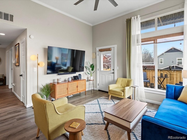 living room with crown molding, ceiling fan, and wood-type flooring