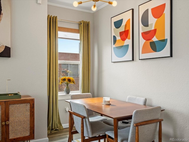 dining area featuring crown molding and hardwood / wood-style floors