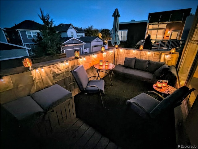 deck at dusk with an outdoor living space