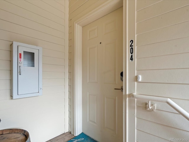 doorway to property featuring electric panel