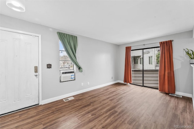 17004 E Tennessee Dr Unit 103, Aurora, CO 80017 - unfurnished room with plenty of natural light, wood finished floors, and baseboards