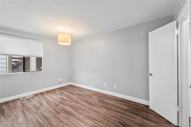 17004 E Tennessee Dr Unit 103, Aurora, CO 80017 - empty room featuring wood finished floors and baseboards