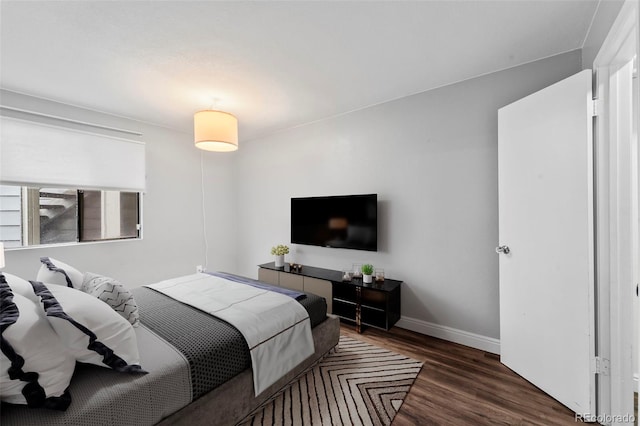 17004 E Tennessee Dr Unit 103, Aurora, CO 80017 - bedroom featuring wood finished floors and baseboards