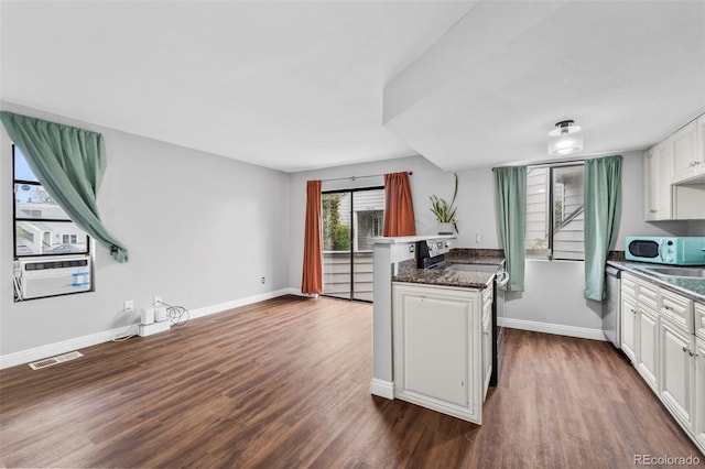 17004 E Tennessee Dr Unit 103, Aurora, CO 80017 - kitchen with appliances with stainless steel finishes, dark wood-type flooring, baseboards, and white cabinets