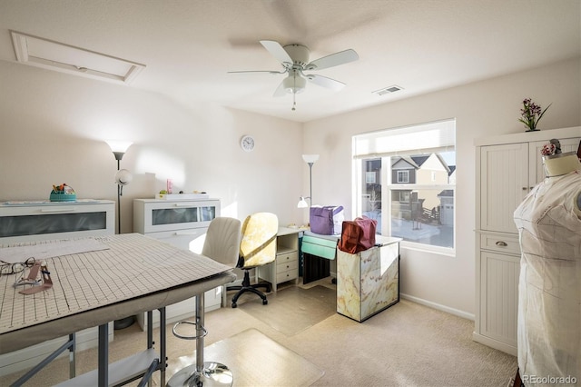 office featuring ceiling fan and light colored carpet