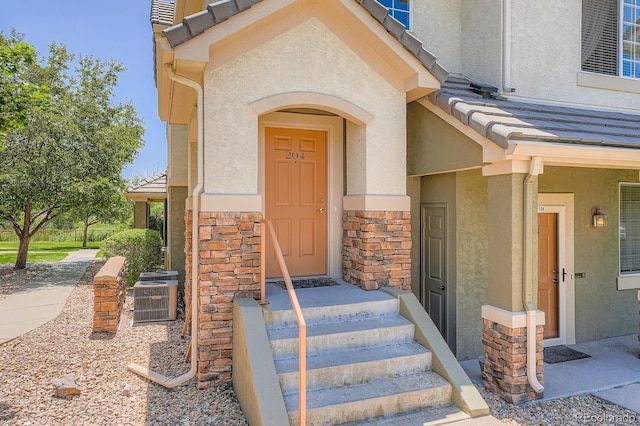 22560 E Ontario Dr Unit 204, Aurora, CO 80016 - entrance to property featuring stucco siding and stone siding