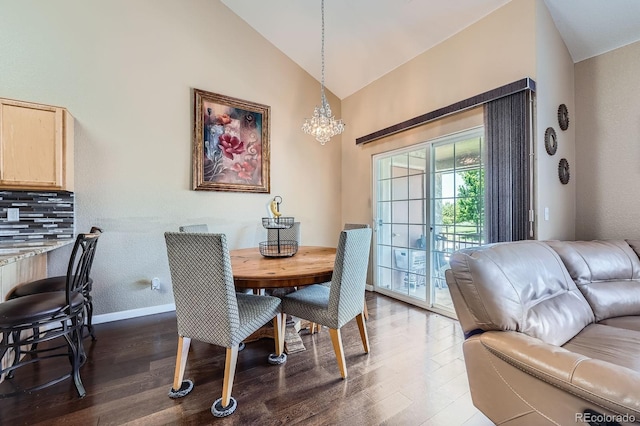 22560 E Ontario Dr Unit 204, Aurora, CO 80016 - dining room featuring dark wood-type flooring, a chandelier, and high vaulted ceiling