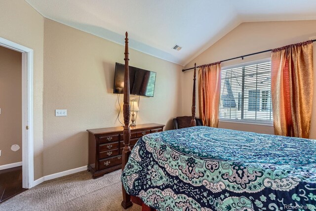 22560 E Ontario Dr Unit 204, Aurora, CO 80016 - carpeted bedroom featuring lofted ceiling and baseboards