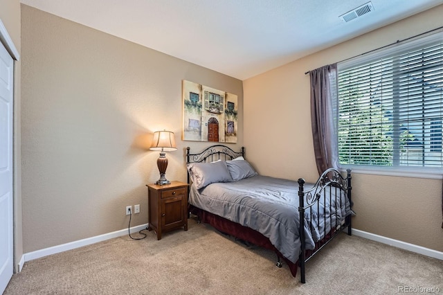 22560 E Ontario Dr Unit 204, Aurora, CO 80016 - bedroom with light colored carpet and baseboards