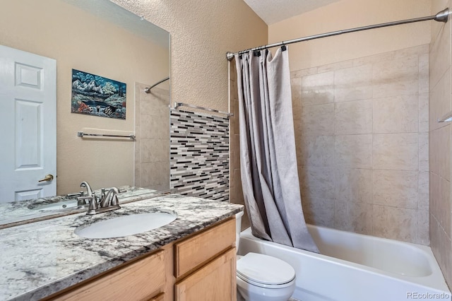 22560 E Ontario Dr Unit 204, Aurora, CO 80016 - full bathroom with vanity, shower / tub combo with curtain, and a textured wall