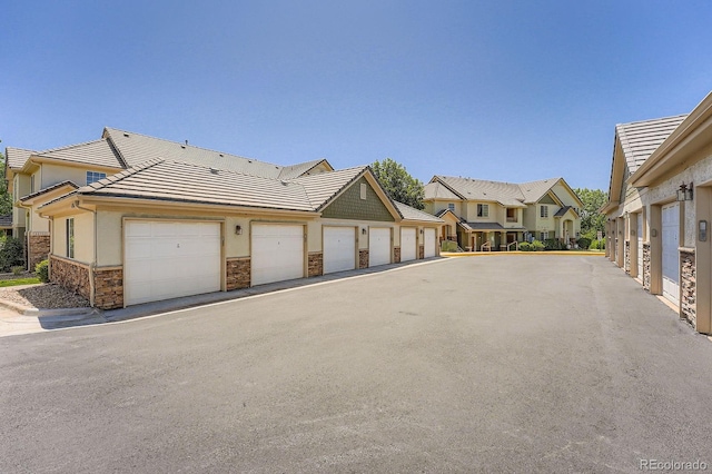 22560 E Ontario Dr Unit 204, Aurora, CO 80016 - view of street featuring community garages and a residential view