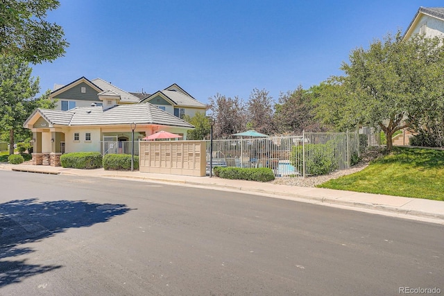 22560 E Ontario Dr Unit 204, Aurora, CO 80016 - view of front facade with a tile roof and stucco siding