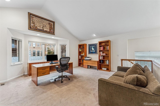 home office featuring high vaulted ceiling, visible vents, baseboards, and light carpet