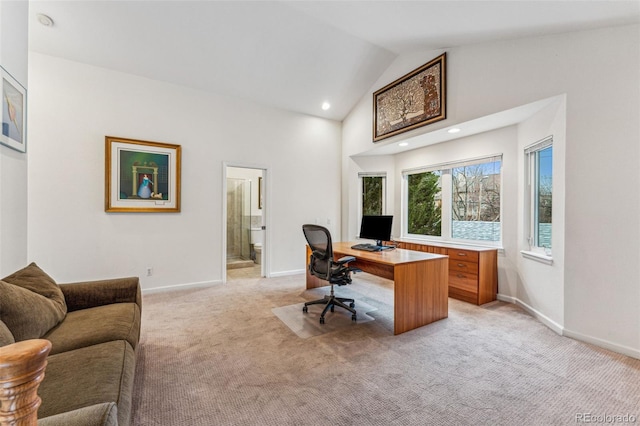 office space with recessed lighting, light colored carpet, baseboards, and high vaulted ceiling