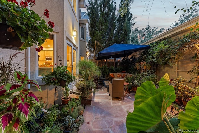 view of patio / terrace featuring fence