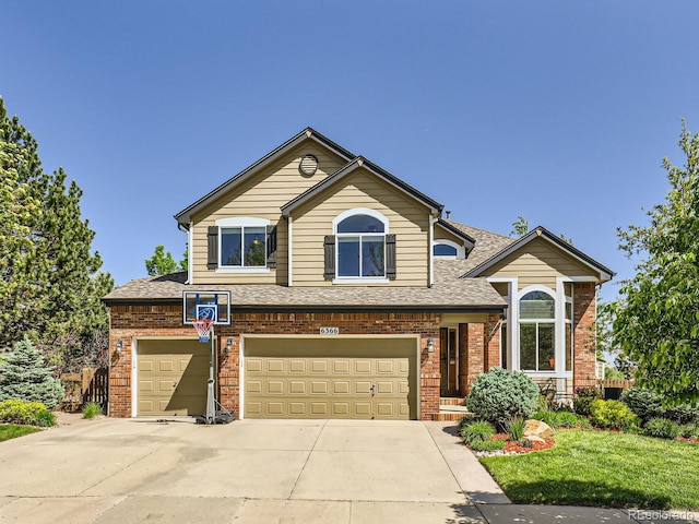 6366 Umber Cir, Arvada, CO 80403 - traditional home with brick siding, a shingled roof, concrete driveway, and an attached garage