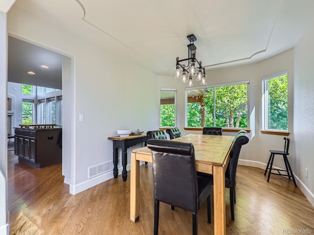 6366 Umber Cir, Arvada, CO 80403 - dining space featuring healthy amount of natural light, light wood finished floors, and baseboards