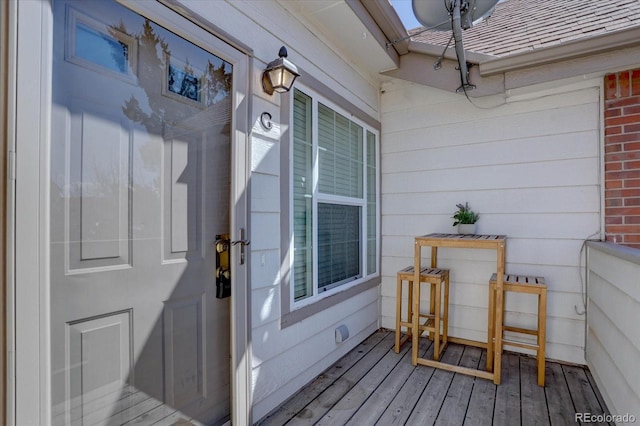 view of exterior entry featuring brick siding