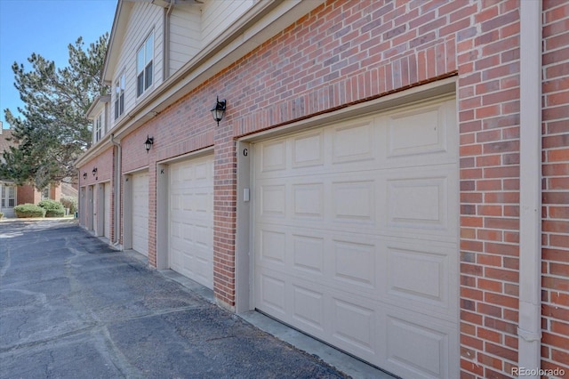 garage featuring driveway