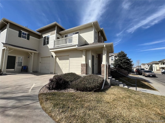 13013 Grant Cir Unit C, Thornton, CO 80241 - view of front of property featuring a balcony, a garage, and driveway